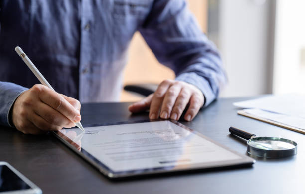 Man Signing The Digital Contract
